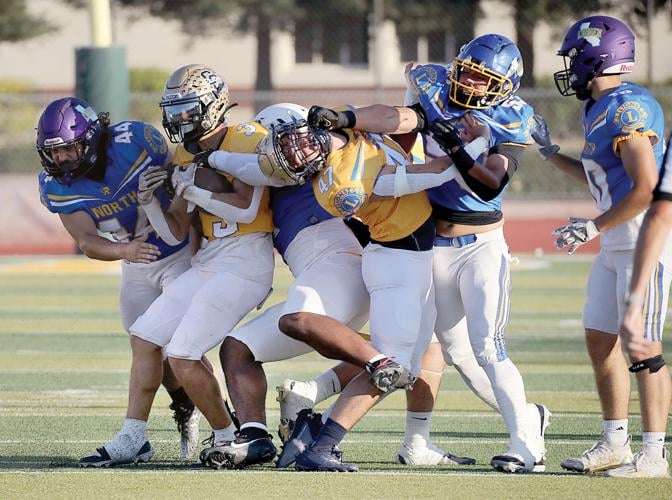 North and South All-Star players tangle during the 2024 Lions All-Star football game at Wayne Schneider Stadium