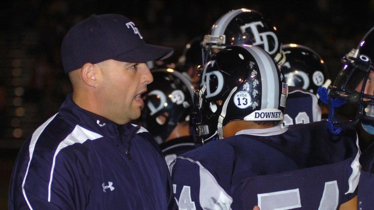 Downey coach Jeremy Plaa with Downey players before the 2015 Lions All-Star Game.