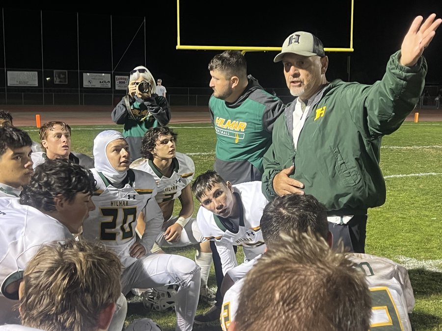 Hilmar coach Frank Marques talks with players during a football game
