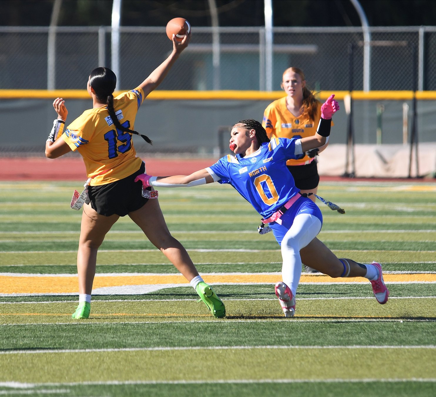 Keira McCulley reaches for Sovannary Carter during the 2026 Lions All-Star Flag Football Game